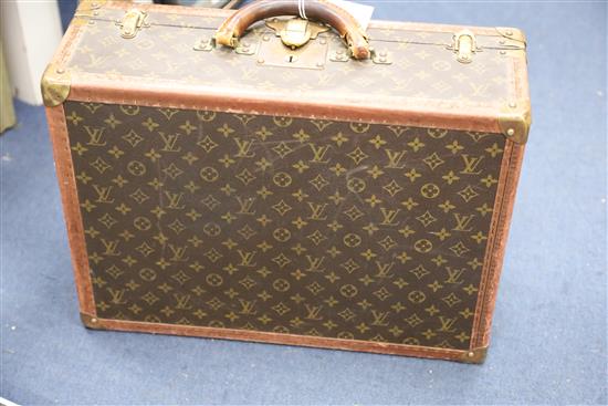 A Louis Vuitton suitcase, 20 x 14.5 x 7in.